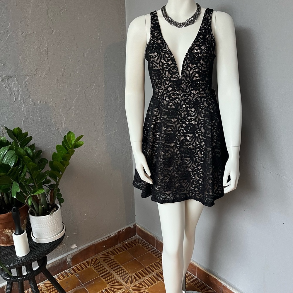 Express. Black lace mini dress/romper with nude liner.